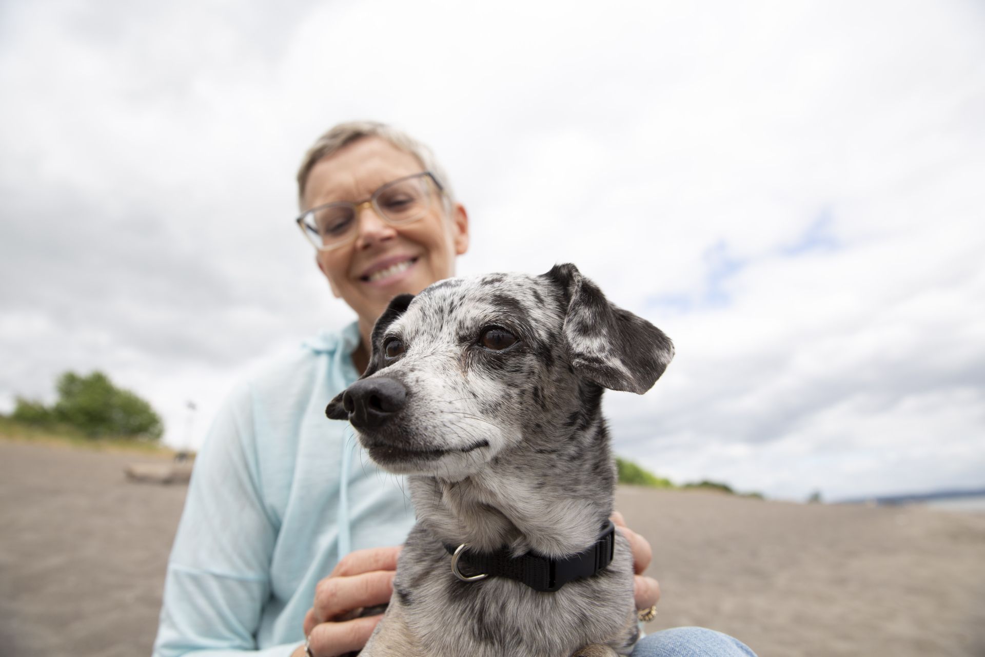 Woman with dog on beach