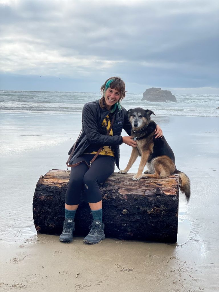 OHS trainer Teresa with dog at the beach