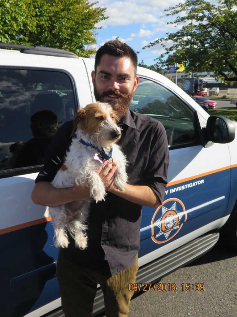 John and Baxter, a dog helped by the OHS Investigations Department.