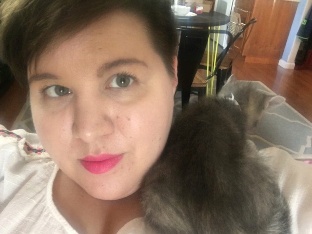 volunteer laura horon cuddling with cat